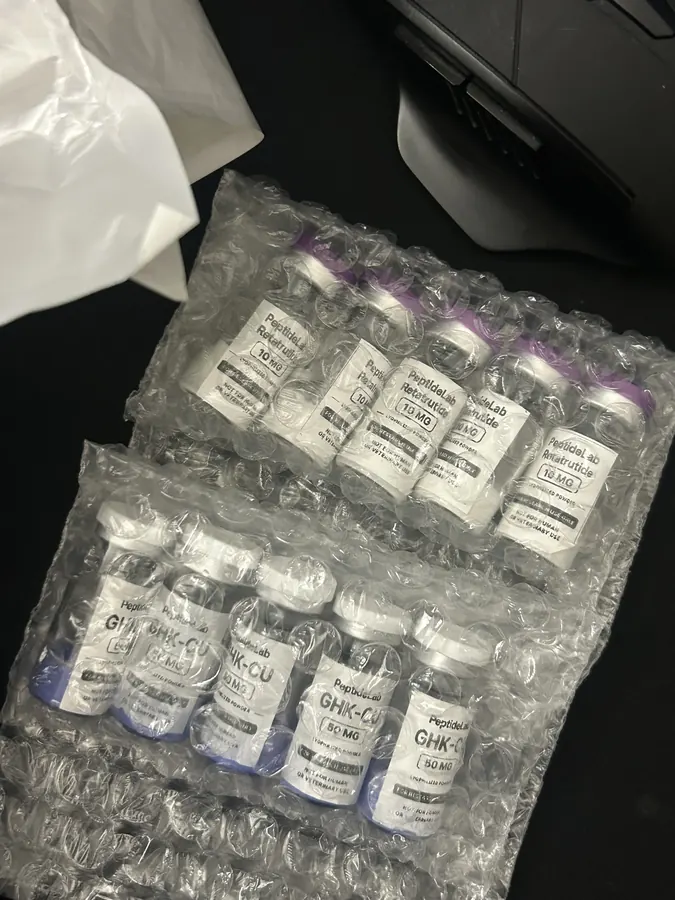 Fatima J.'s PeptideLab order containing Retatrutide and GHK-Cu research vials